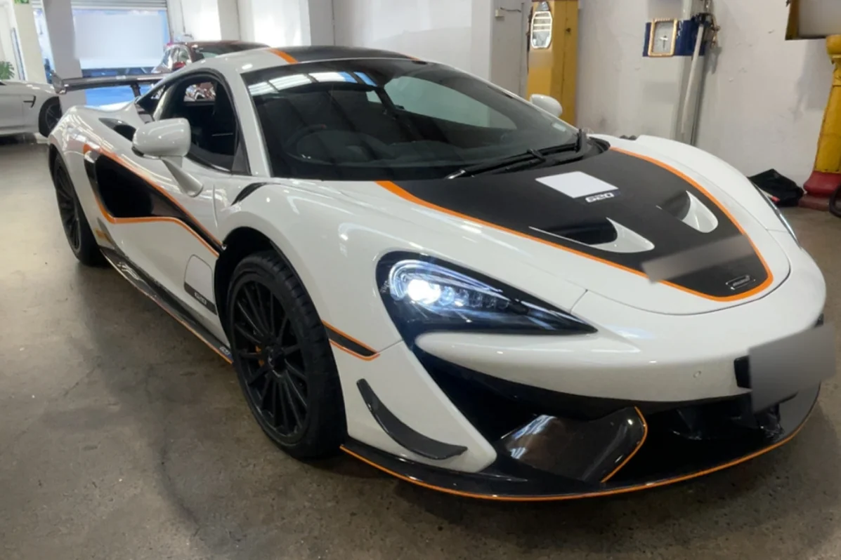 White McLaren with black and orange detailing