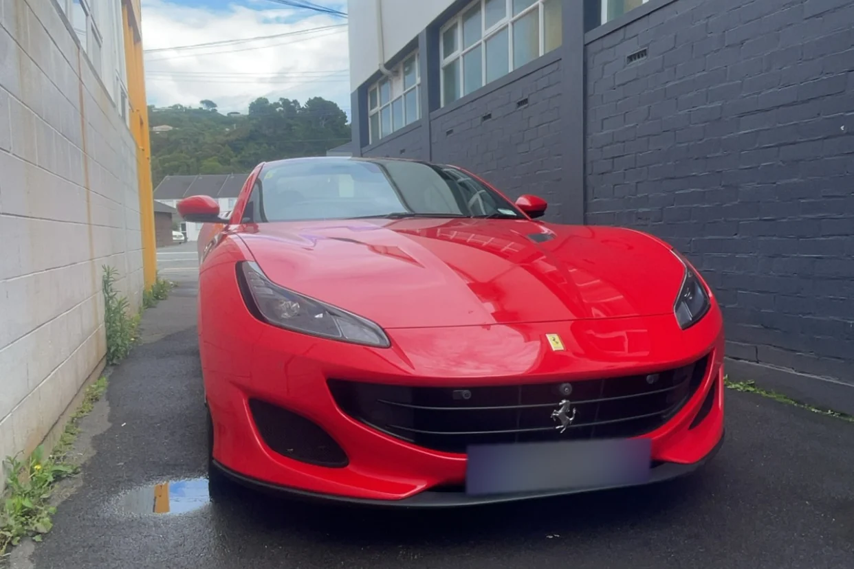 Red Ferrari photographed from the front